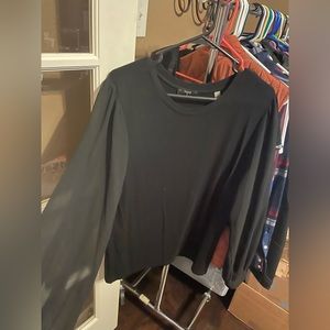 Tahari black top with sheer sleeves. Size XL.
